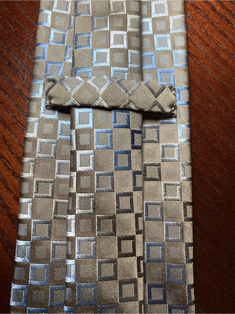 Men’s neck tie by Murano in light brown with a hint of blue & gray small squares